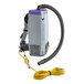 A ProTeam backpack vacuum with a hose attached and a cord.
