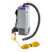 A ProTeam backpack vacuum with a hose attached to a hard floor kit.
