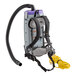 A ProTeam backpack vacuum with a hose attached.