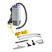 A ProTeam Super Coach Pro backpack vacuum with accessories including a hose and wand.