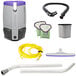 A white ProTeam backpack vacuum with hose and accessories.