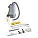 A ProTeam backpack vacuum with a hose and accessories.
