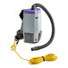 A white ProTeam backpack vacuum with a yellow cord and hose attached.