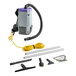 A ProTeam backpack vacuum with a hose and tools.