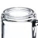 A close up of a Libbey clear glass warm beverage mug.