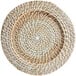 A white wicker charger plate with a spiral pattern.
