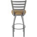A Holland Bar Stool outdoor counter stool with a beige cushion on the seat and back.
