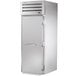 A white True STA1FRI-1S Spec Series roll-in freezer with a stainless steel door and handle.