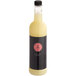 A bottle of Twisted Alchemy Cold-Pressed Grapefruit Juice with a black label.