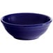 A blue bowl with a white interior and rim.