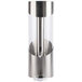 A silver stainless steel beverage dispenser with a round base and a glass top.