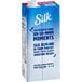A carton of Silk Almond Milk on a counter.