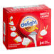 A red box of International Delight Sweet & Creamy coffee creamer with a red lid.