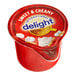 A box of 24 International Delight Sweet & Creamy single serve non-dairy creamers on a white background.
