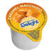 A close up of a box of International Delight Caramel Macchiato Single Serve Non-Dairy Creamer.