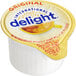 A close up of a container of International Delight Original single serve non-dairy creamer.
