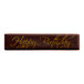 A Chocolatree chocolate bar with gold writing that says "Happy Birthday" on a white background.