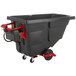 A black Rubbermaid garbage cart on wheels with red accents.