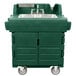 A green Cambro portable hand sink on a cart with wheels.