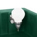 A green Cambro CamKiosk portable hand sink with a white light above it.