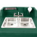 A green Cambro CamKiosk portable self-contained hand sink with two faucets and two sinks.