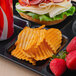 A tray with a sandwich, strawberries, a Martin's Bar-B-Q Waffle Potato Chip bag, and a drink on a counter.