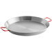 A Vigor 18" carbon steel paella pan with red handles.