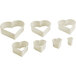 A white Mercer Culinary 7-piece set of heart shaped cookie cutters.