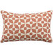 An Astella peach and white geometric throw pillow with a pattern.