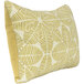 An Astella throw pillow with a yellow and white leaf pattern.