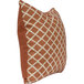 An Astella Lavalier apricot and pottery throw pillow with a geometric pattern in orange and white.