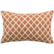 An orange and white Astella Lavalier throw pillow with a geometric pattern.