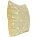An Astella Palmetto throw pillow with a yellow and white leaf pattern.