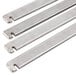 A close-up of three stainless steel metal bars of different lengths.