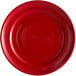 A red plate with a circular pattern on it.