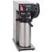A Bunn Axiom airpot coffee brewer with a stainless steel container and screen.