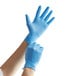 A person wearing blue Showa nitrile gloves.