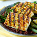 A plate of food with grilled Franklin Farms Organic Firm Tofu and vegetables.