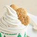 A cup of frozen yogurt topped with Homefree mini vanilla cookies.