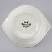 A white Tuxton china bowl with black text that says "Gourmet Onion" on it.