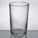 A close up of a Libbey clear juice glass with a rim.