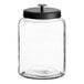 An Acopa Dusk clear glass jar with a black lid.