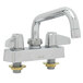 A silver Equip by T&amp;S deck-mounted faucet with two handles.