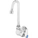 A silver T&S wall mount single temperature faucet with a blue handle.