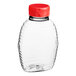 A clear plastic bottle with a red cap containing Classic Queenline PET Honey Bottle with Heat Induction Seal Liner.