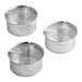 Three stainless steel strainer baskets with holes.