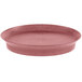 An oval raspberry polypropylene deli server with a red rim.