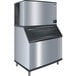 A Manitowoc stainless steel Indigo Series air cooled ice machine with a stainless steel cabinet.