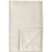A white Snap Drape Windsor Damask cloth napkin with a stitched edge folded into a triangle.