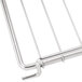A Cooking Performance Group stainless steel wire oven rack with a handle.